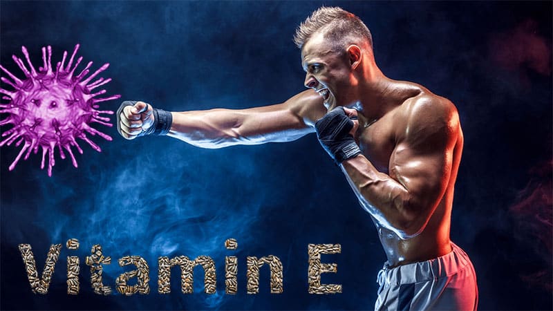 A man is boxing in front of the name vitamin e.