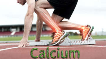 A man running on the track with his legs in motion.
