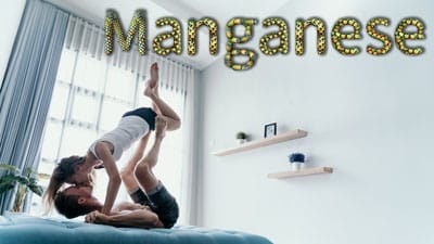 Two people doing a handstand on top of each other.