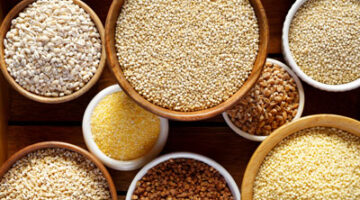 A table topped with bowls of different types of grains.