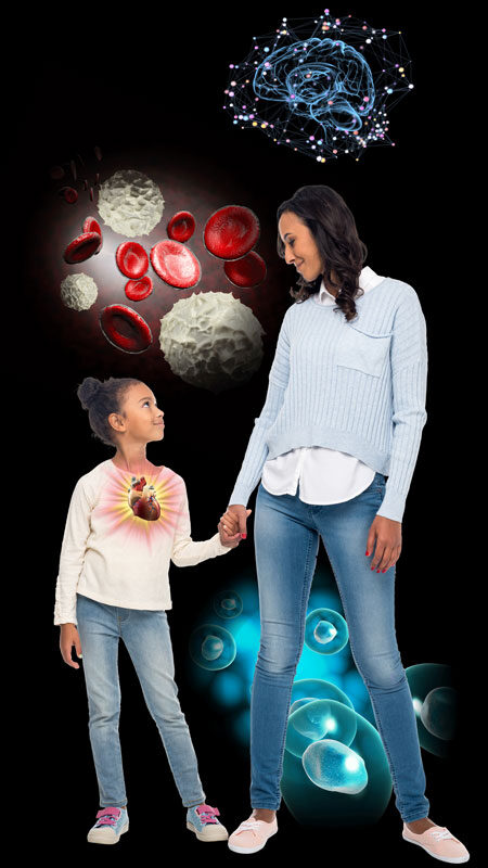 A woman and child holding hands in front of a black background.