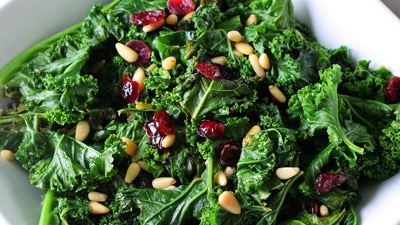Enhance vitamin K benefits by adding a small source of healthy fats to your leafy greens or green vegetables like this green salad with pine nuts.